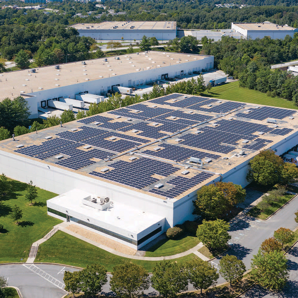 Aerial image of a building with solar panels on its roof