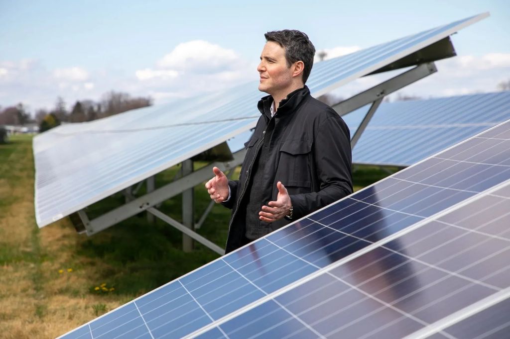 Eric Duchon with Altus Power Solar Panels